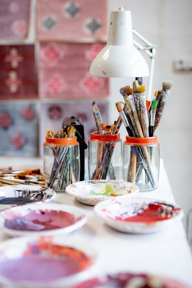 A row of well-used studio brushes