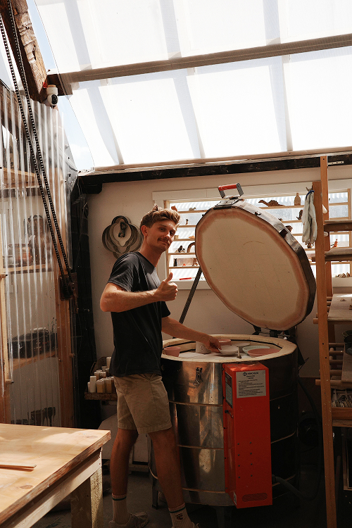 Haydn loading a kiln during a firing